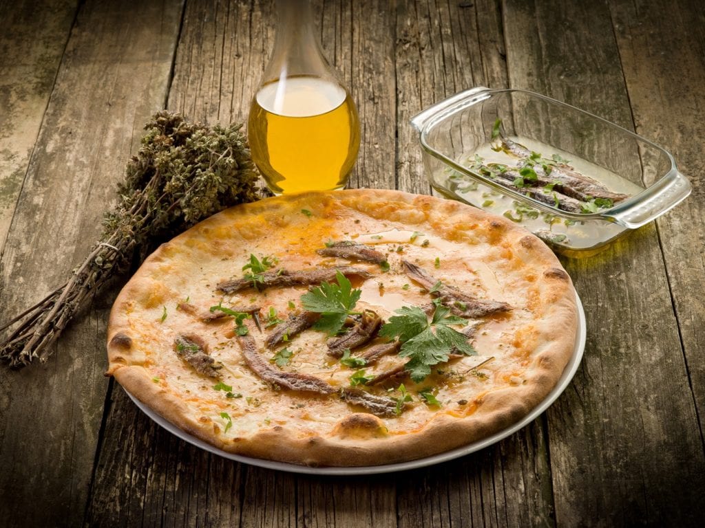 pizza napoli with anchovy and oregan