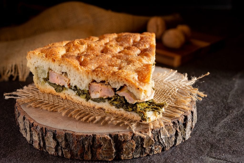 neapolitan homemade pizza with pork sausages and friarielli broc