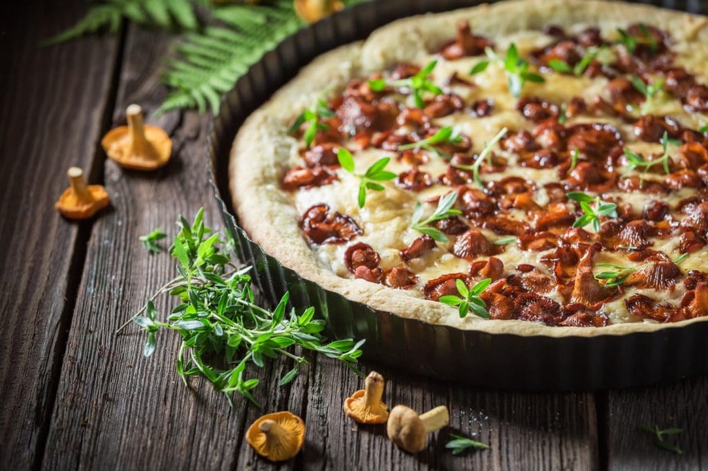tasty and homemade pie made of wild mushrooms and herbs